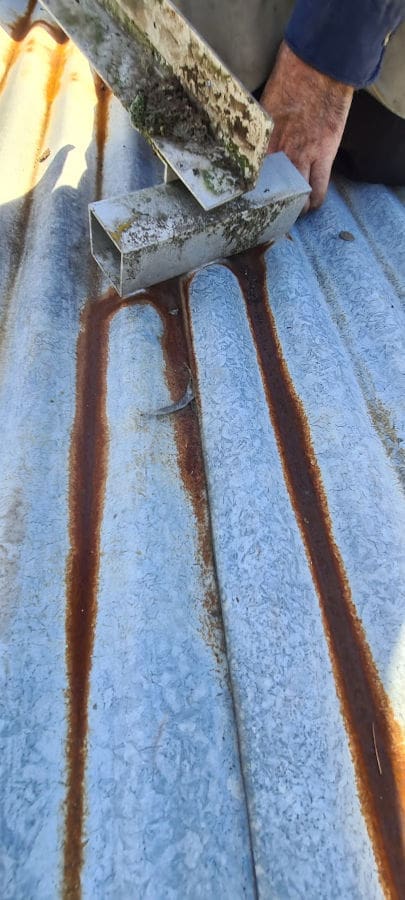 Metal roof with rust before coating